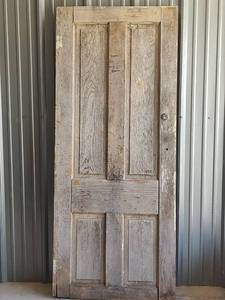 lot 1027 image: Reclaimed Weathered Wood Door with Original Hardware, 30 x 72