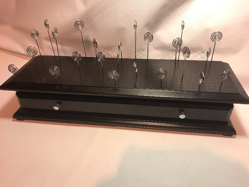lot 9428 image: Unique picture display has wire picture holders talk is lined with holes to move wires anywhere you want slide out storage drawer 20 inches long very neat