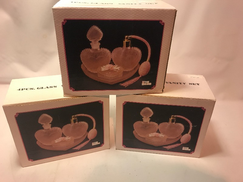 lot 9674 image: Set of three perfume bottle sets