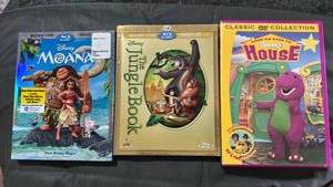 lot 388 image: Disney and Childrens Movies DVD Collection Bundle - Moana, Jungle Book, & Barney