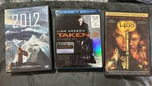 lot 396 image: Action and Horror Movie DVD Collection - 3 Films Including 2012, Taken 2, and Stephen Kings 1408.