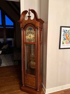 lot 27 image: Howard Miller Grandfather Clock with Moon Phase Dial