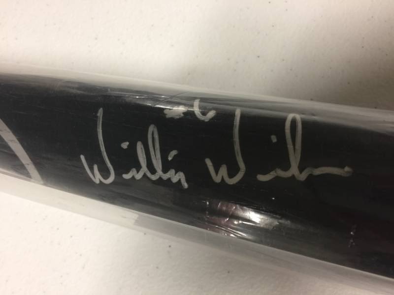 lot 1014 image: Signed Willie Wilson Official Rawlings Full Sized Black Baseball Bat in Silver Ink With James Spence Authentication and Certificate of Authenticity