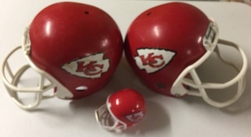 lot 1195 image: Three Kansas City Chiefs Toy Helmet - Two Child Sized Helmets and One Toy Sized