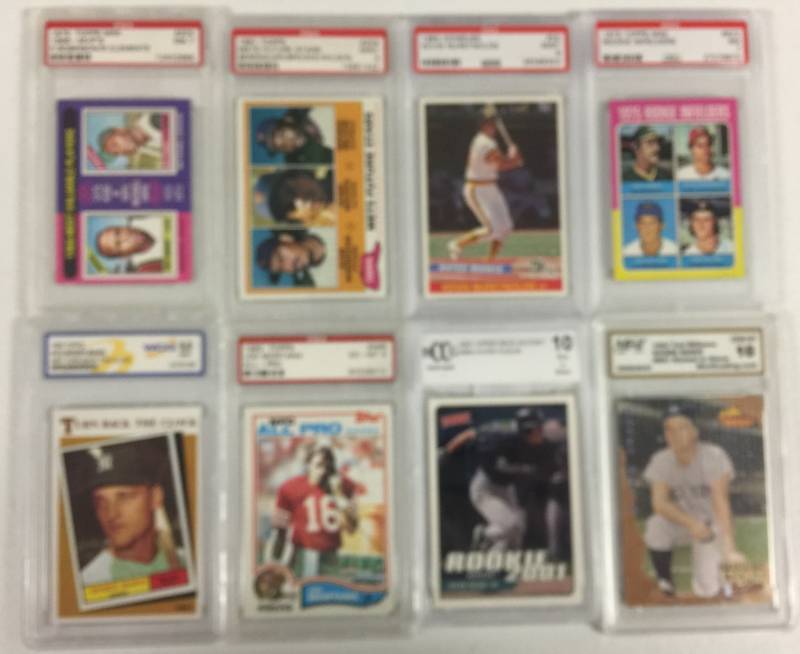 lot 1099 image: Eight Professionally Graded Sports Cards with Roberto Clemente Original 1975 Topps Card, Roger Maris, Joe Montana, Ichiro Rookie Card & More