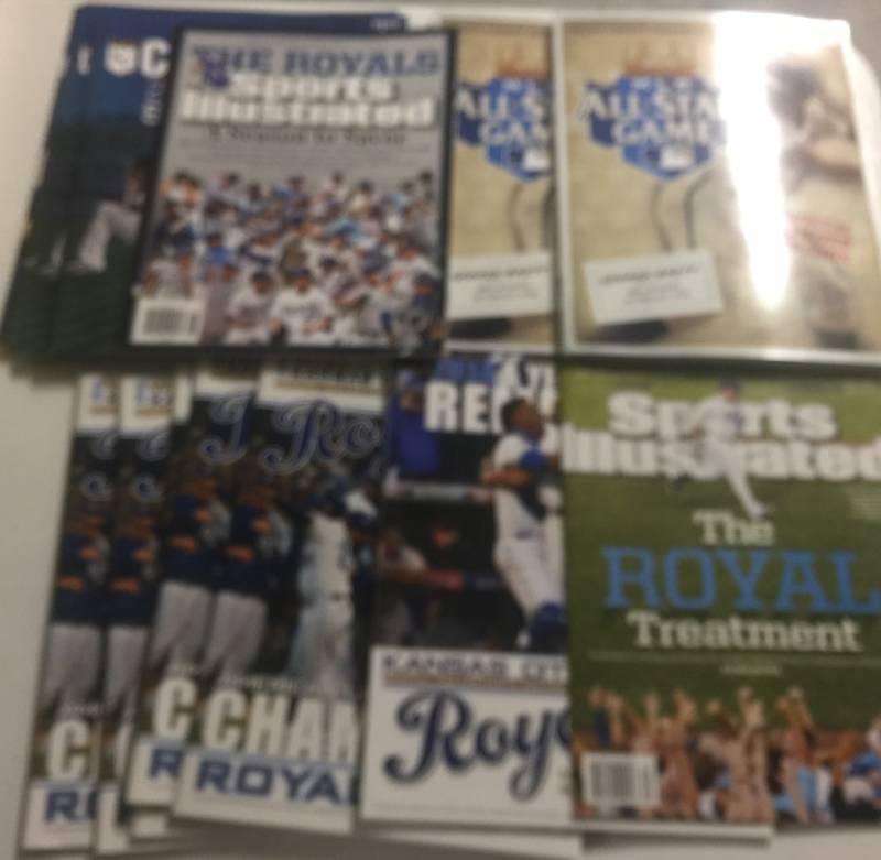 lot 1164 image: Huge Lot of Kansas City Royals Yearbooks, Score Cards, and Sports Illustrated Mostly for 2014 American League Champions