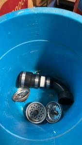 lot 11562 image: Drain plugs and bucket