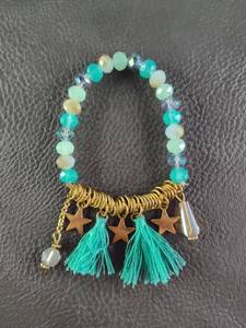 lot 2009 image: Turquoise Crystal Beaded Bracelet with Star Charms and Tassels