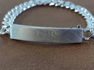 lot 2018 image: Silver-Toned Bracelet with Doris Engraving