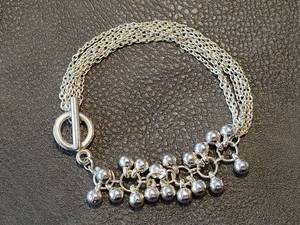 lot 2048 image: Silver-Toned Multi-Chain Ball Drop Bracelet
