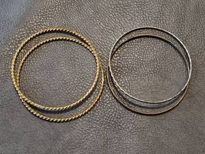 lot 2052 image: Silver and Gold-Toned Twisted Bangle Set