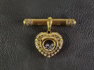 lot 2063 image: Gold Tone Heart Floating Crystals Brooch