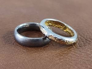 lot 2104 image: Set of Two Rings Silver-Toned King Will and Undecipherable Dual-Toned