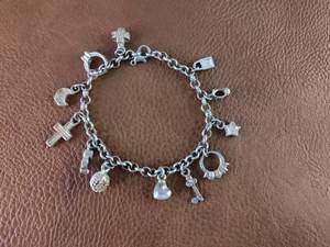 lot 2105 image: Silver-Toned Multi-Charm Bracelet