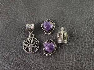 lot 2110 image: Purple Swirl Heart and Tree of Life Charm Set