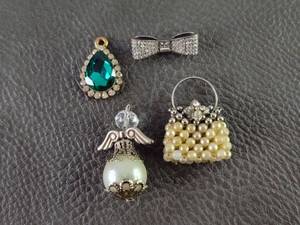 lot 2116 image: Crystal Bow and Pearl Angel Pendant Set