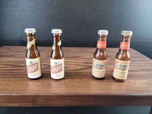 lot 2506 image: Schlitz and Budweiser Mini Beer Bottle Salt and Paepper Shakers Set
