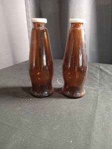lot 2675 image: Beer bottle salt and pepper shaker set