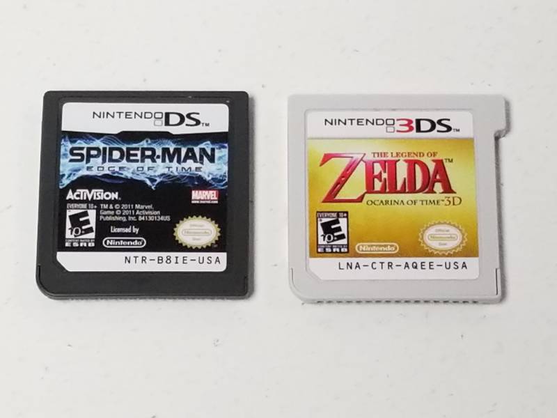 lot 1069 image: Nintendo DS Lite Legend of Zelda Ocerina of Time 3D & Spiderman Video Game Lot
