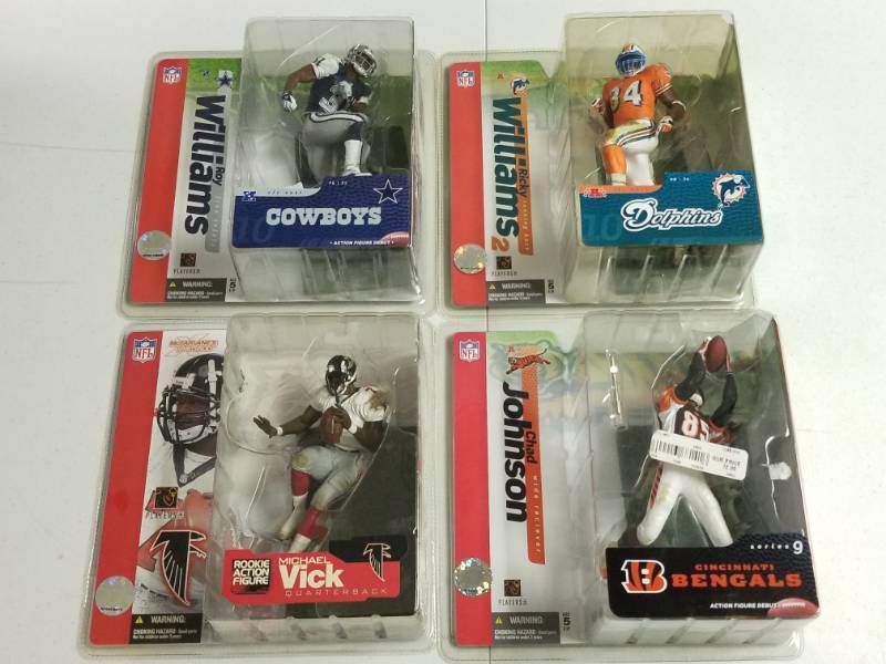 lot 1078 image: McFarlane NFL Action Figure Lot of 4 Different w Michael Vick & Ricky Williams Variant New