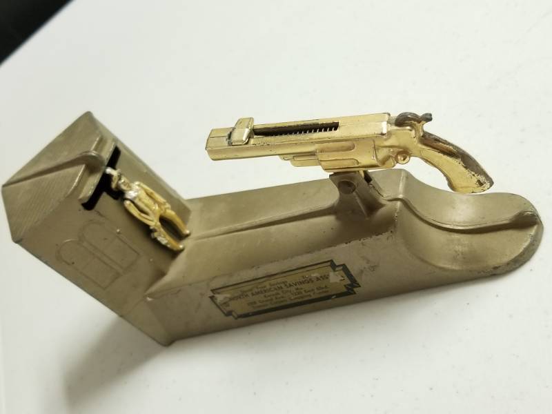 lot 1080 image: Vintage Wild West Shooting Coin Bank Mechanical Gun Works Great