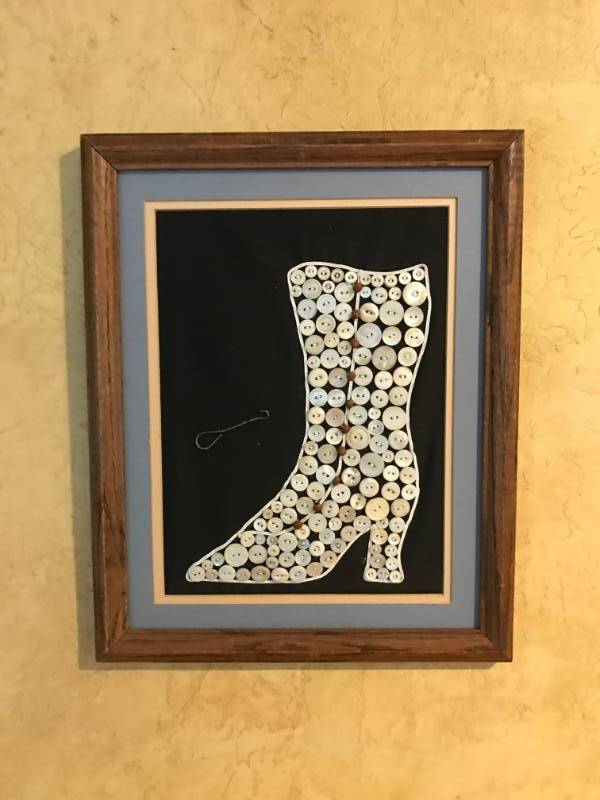 lot 2475 image: Framed Wall Dcor of Vintage womans boot (made of pearly buttons)