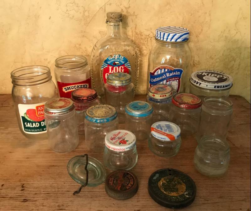 lot 2527 image: Assortment of Antique glass jars (including several baby jars) and Log Cabin Syrup Bottle