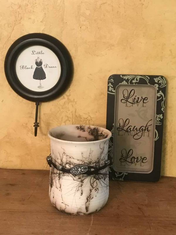 lot 2549 image: Live Laugh Love with ceramic vase and little black dress wall hook
