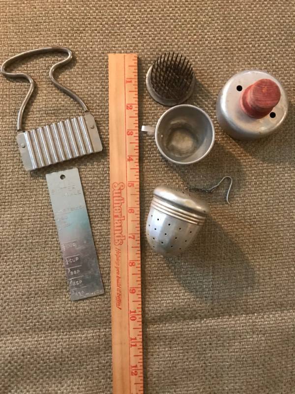 lot 2766 image: Vintage Kitchen Items (biscuit cutter with handle, flower frog, etc.)