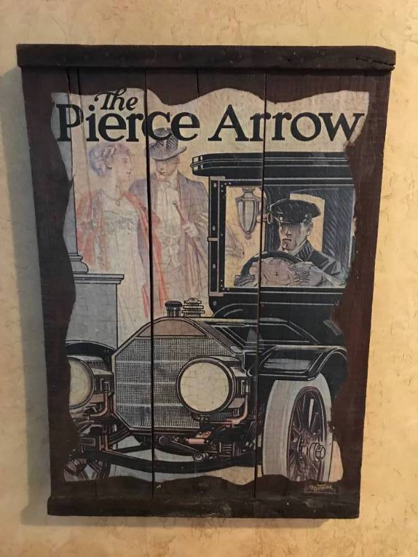 lot 2830 image: Vintage Wood Pallet with Pierce Arrow Ad Poster