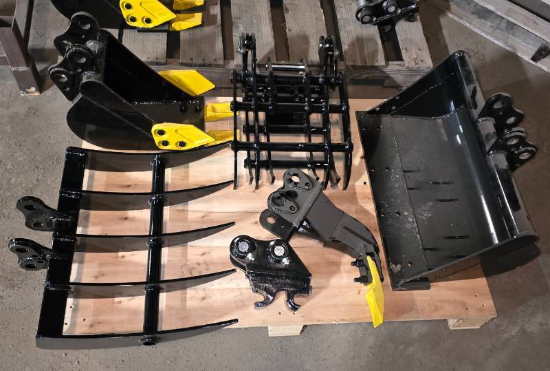 lot 6300 image: Unused Lot of Six (6) Mini Excavator Attachments - Fits 1-2 ton Mini Excavators - Rake - Quick Attach Coupler - Ripper - Tooth Bucket - Grapple - 24in Flat Bucket