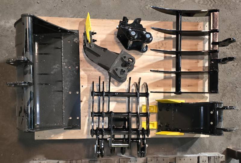 lot 6301 image: Unused Lot of Six (6) Mini Excavator Attachments - Fits 1-2 ton Mini Excavators - Rake - Quick Attach Coupler - Ripper - Tooth Bucket - Grapple - 24in Flat Bucket
