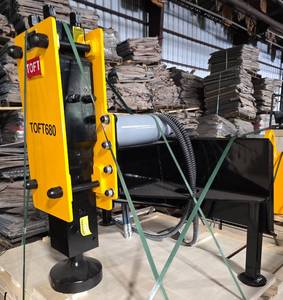 lot 5482A image: Unused TOFT 680 Post Driver for Skid Steer Loader - Comes with One 200mm Post Cup, Two Hoses, One Nitrogen Charging Kit, One Tool Box w Maintenance Tools