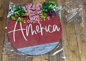lot 5386015 image: God Bless America Patriotic Wood Sign with Artificial Greenery - Retail $15