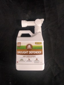 lot 5386021 image: Turf Titan Drought Defender Hose End, Garden Soil and Lawn Care Shield, 32 oz - Retail $32