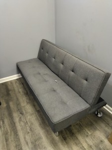 lot 5386111 image: Gray Upholstered Futon  - Retail $0