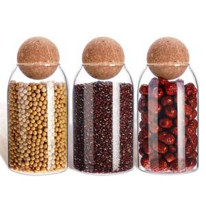 lot 4711 image: 3 Pcs Glass Jar with Ball Cork Lid Decorative Round Bottle Sealed Canister Jar Storage Container Organizer with Airtight Seal Wooden Lid for Food Coffee Bean Candy Biscuits Spice(800 ML 27 Oz)