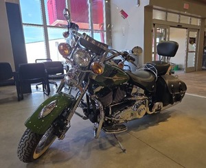 lot 1300 image: 2003 Harley-Davidson FLSTSI 100th Anniversary Heritage Softail Springer - Green 1450CC