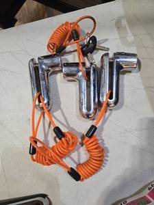 lot 1495 image: (3) Chrome Motorcycle Disk Brake Lock with Orange Reminder Cable