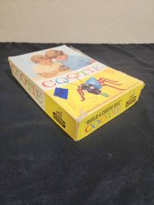 lot 14 image: Vintage Build A Cootie Bug Board Game - missing a few bug body parts.  Box has one side coming detached.