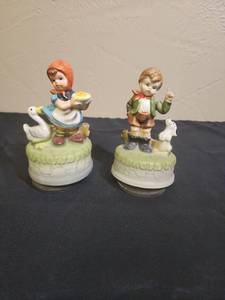 lot 50 image: Country Children Music Box Figurines Set of 2 - girl plays music and turns, boy tries to work but struggling and not fully playing or spinning