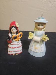 lot 55 image: Decorative Sewing Pin Cushion Ceramic Figurines - one holds a removable pair of tiny scissors, both have Styrofoam pin cushion heads