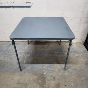 lot 305 image: Gray folding card table - has  edge wear on the vinyl