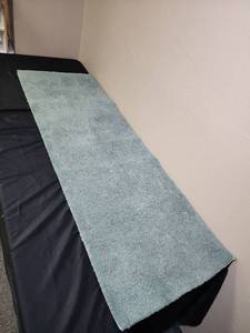 lot 363 image: Mint green bath mat 20 w x 60 L - has one small white stain spot which may come out.  Will need a wash