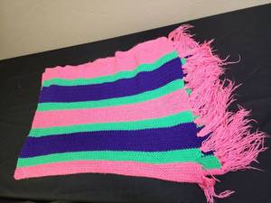lot 370 image: Brightly colored Striped Afghan with fringe - has a couple of small holes (see photo)