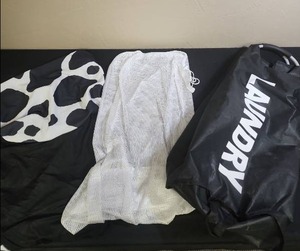 lot 401 image: Three Large Laundry Bags, Black mesh with cow print lid, white draw string mesh, and a laundry bag with handles