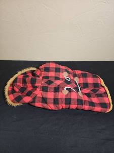 lot 415 image: Buffalo Plaid Sherpa Dog Coat - for medium to large dog - has a small rip on the plaid near the velcro on the belly side