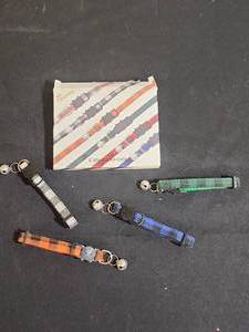 lot 413 image: Four brand new Plaid Cat Collars with Bells - in open box but new condition