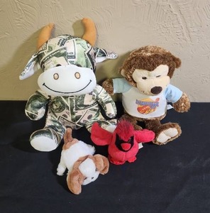 lot 438 image: Plush Animal Collection - Money Cow, Nashville Bear, a red cardinal and a FurReal Friend puppy (uses batteries, untested)