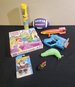 lot 440 image: Mixed Toy Lot - Candy Land, Nerf Gun, Hot Wheels, Pick Up Sticks, K-State Mini Football (needs air), rubber torpedo and and a wiggly caterpillar